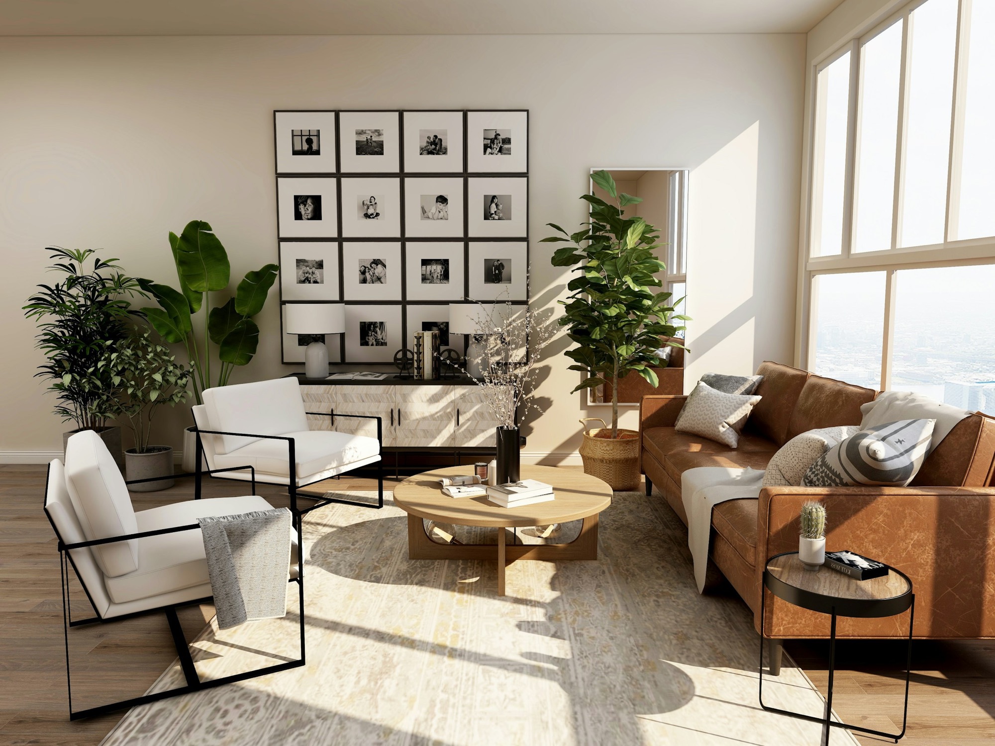 A sunlit living room with a leather sofa, white armchairs and a gallery wall.
